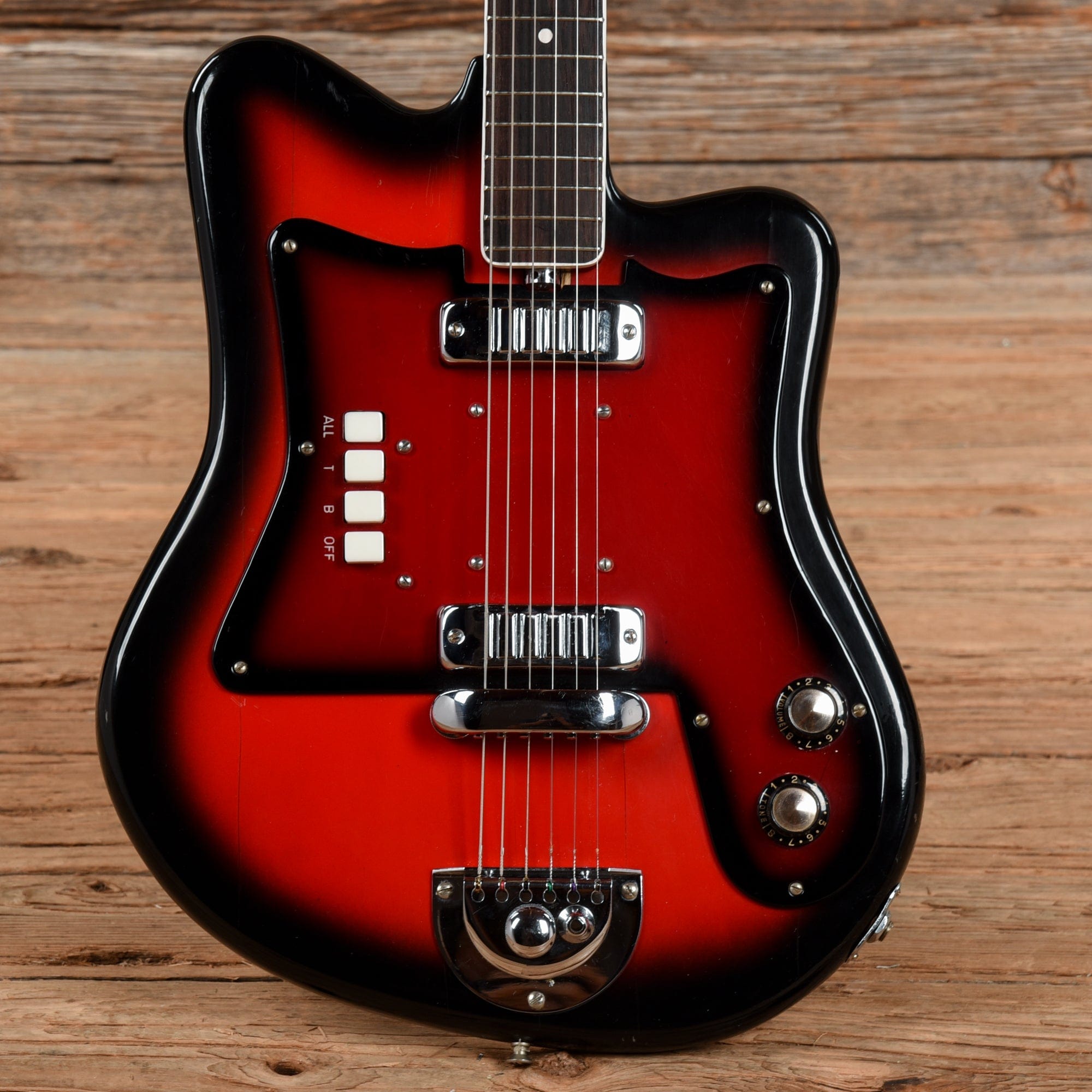 https://www.chicagomusicexchange.com/cdn/shop/files/continental-electric-guitars-solid-body-continental-2-pickup-electric-red-burst-1960s-u5231477401-30651716468871_2000x.jpg?v=1695914942